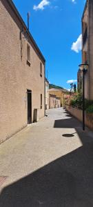 an empty alley with a building and a street at Les naïades C7, jusqu'à 6 personnes in Avène