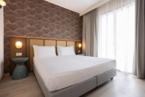 Postel nebo postele na pokoji v ubytování Hotel Diana