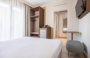Postel nebo postele na pokoji v ubytování Hotel Diana