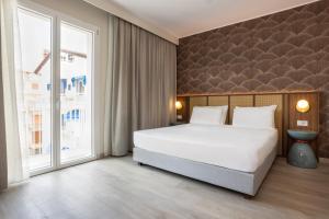 Postel nebo postele na pokoji v ubytování Hotel Diana