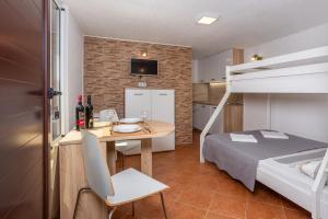 Łóżko lub łóżka w pokoju w obiekcie Apartments Villa Temer