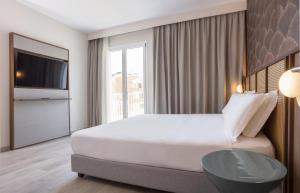 Postel nebo postele na pokoji v ubytování Hotel Diana
