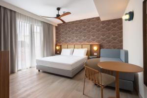 Postel nebo postele na pokoji v ubytování Hotel Diana