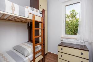 Łóżko lub łóżka w pokoju w obiekcie Apartments Villa Temer