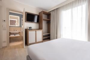 Postel nebo postele na pokoji v ubytování Hotel Diana