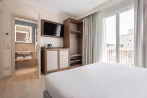 Postel nebo postele na pokoji v ubytování Hotel Diana