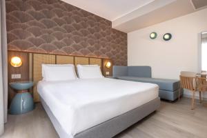 Postel nebo postele na pokoji v ubytování Hotel Diana