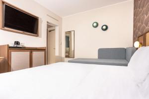 Postel nebo postele na pokoji v ubytování Hotel Diana
