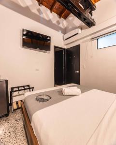 Ein Bett oder Betten in einem Zimmer der Unterkunft Mándala Botero Medellín
