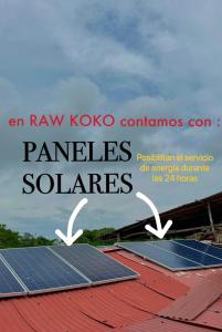 a group of solar panels on top of a roof at Raw KokoMar PosadaNativa in Barú