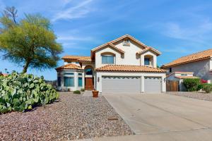 a house with a driveway and a garage at Sonoran Oasis in Mesa