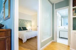 מיטה או מיטות בחדר ב-Apartamento Tosca Deco