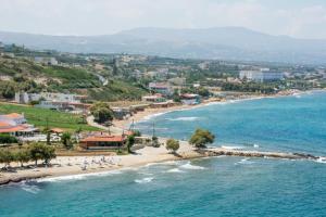 an aerial view of a beach with people on the sand at Ammos Beach Apartment in Skaleta