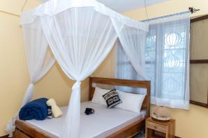 Ένα ή περισσότερα κρεβάτια σε δωμάτιο στο Mahali House +21 φωτογραφίες
