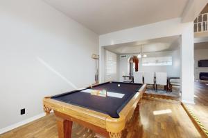 a room with a pool table and a dining room at Sonoran Oasis in Mesa