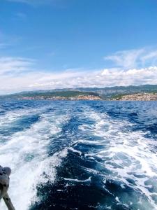 a view from the back of a boat in the water at More in Crikvenica