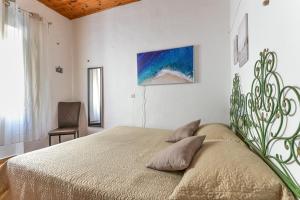 En eller flere senge i et værelse på Casina vintage - Rio Marina