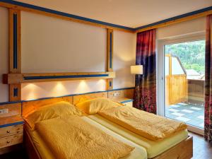 Posteľ alebo postele v izbe v ubytovaní Alpenpension Gastein