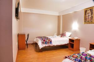 Letto o letti in una camera di Hotel Joram