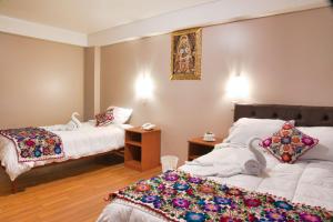 Katil atau katil-katil dalam bilik di Hotel Joram