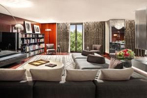 a living room with a couch and a table at Bvlgari Hotel London in London