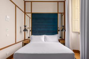Cama ou camas em um quarto em Room Mate Luca, Florence