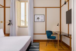 Cama ou camas em um quarto em Room Mate Luca, Florence
