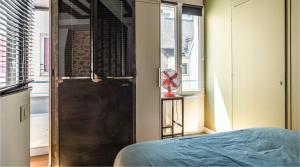 Posteľ alebo postele v izbe v ubytovaní The 199 - Charming apartment in the heart of Paris
