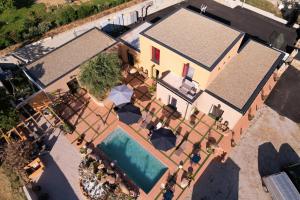 an overhead view of a house with a swimming pool at A CASA DI JO in Calenzana