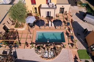 an overhead view of a swimming pool with umbrellas at A CASA DI JO in Calenzana