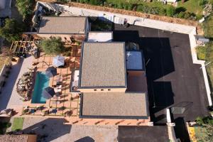 an overhead view of a house with a swimming pool at A CASA DI JO in Calenzana