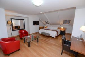 Postel nebo postele na pokoji v ubytování Hotel Plaza de Armas Cusco