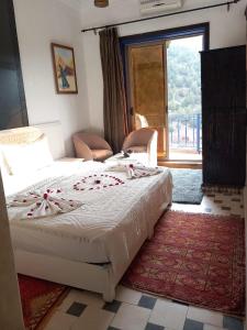 Postel nebo postele na pokoji v ubytování Auberge kasbah tifirte