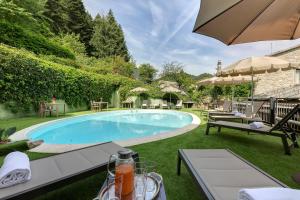 a swimming pool in the backyard of a house at Locanda Senio in Palazzuolo sul Senio
