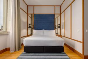 Cama ou camas em um quarto em Room Mate Luca, Florence