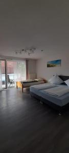 a bedroom with two beds in a room at Ferienwohnung für bis zu 10 Personen in Koetz 