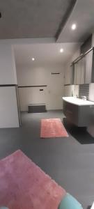 a large bathroom with a sink and a tub at Ferienwohnung für bis zu 10 Personen in Koetz 
