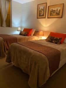 En eller flere senge i et værelse på Villa San Jose