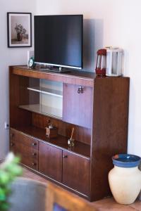 a large wooden entertainment center with a television on it at Holiday Home “Vuko” in Trilj
