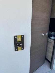 a door in a room with a sign on it at Mirtos4seasons in Myrtos