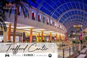 a large shopping mall with a blue ceiling at Modern 1-Bed Apartment - City Centre - FREE Wi-Fi - New - in Manchester +36 photos