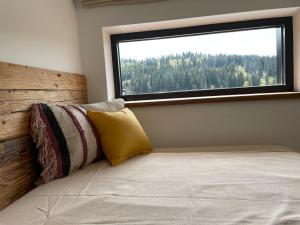 Postel nebo postele na pokoji v ubytování Kaliba Cabins
