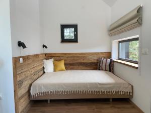 Postel nebo postele na pokoji v ubytování Kaliba Cabins