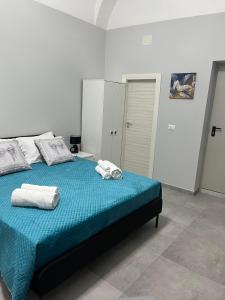 Ένα ή περισσότερα κρεβάτια σε δωμάτιο στο casa vacanza I 4 diamanti room 2