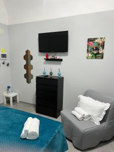 Μια τηλεόραση ή/και κέντρο ψυχαγωγίας στο casa vacanza I 4 diamanti room 2