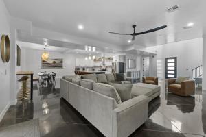 a large living room with a couch and a table at The Millie at Sand Hollow in Hurricane