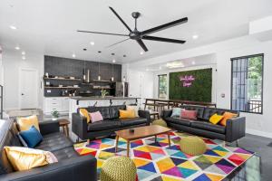 a living room with couches and a table at Sand Hollow Haven in Hurricane