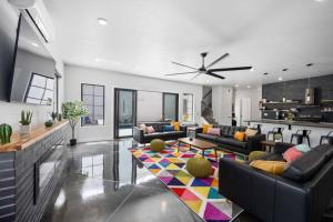 a living room with couches and a colorful rug at Sand Hollow Haven in Hurricane