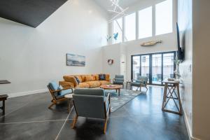 a living room with a couch and chairs at Just Beachy at Sand Hollow in Hurricane