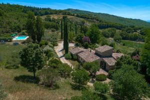 an aerial view of a house with trees and a pool at Morleschio in Perugia